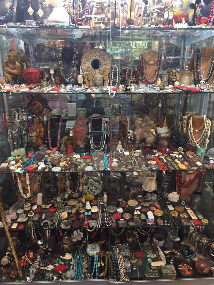 Display with jewelry and other antiques